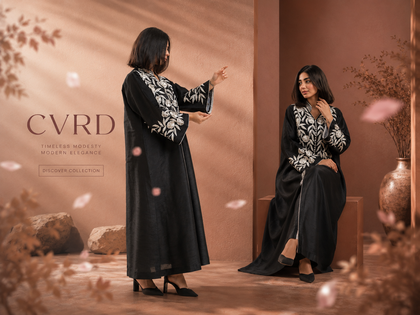 Two women in black and white abayas standing in a softly lit room with decorative elements.